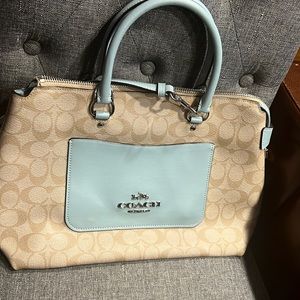 Light blue and tan coach bag.Cross body strap option.